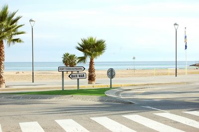 Road by sea against sky