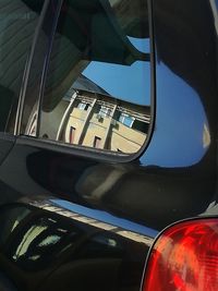 Close-up of side-view mirror of car