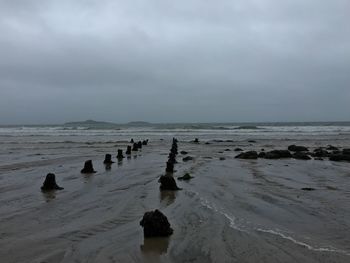 Scenic view of sea against cloudy sky