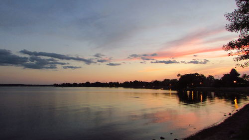 Scenic view of lake against sky during sunset