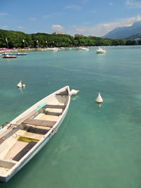 Boats in sea against sky