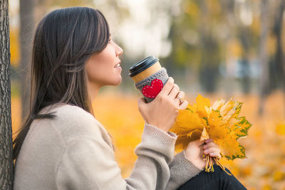 Young woman drinking juice