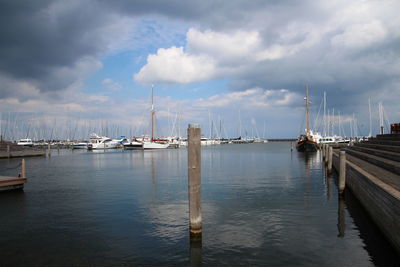 Boats moored at harbor