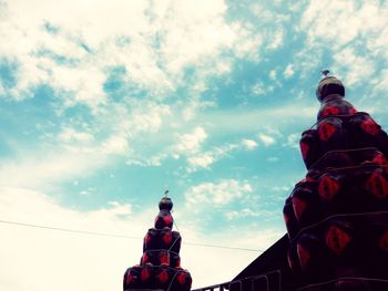 Low angle view of building against cloudy sky