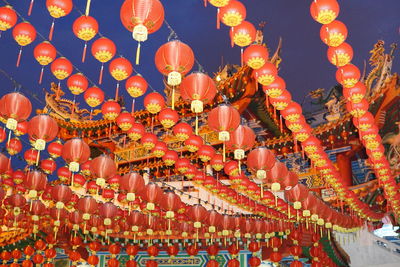 Low angle view of lanterns hanging outside building