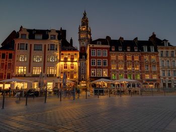 Buildings in city at dusk