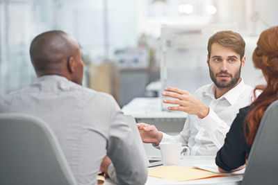 Business colleagues conducting meeting in office