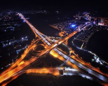 High angle view of illuminated city at night