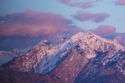 Scenic view of snowcapped mountains against sky during winter