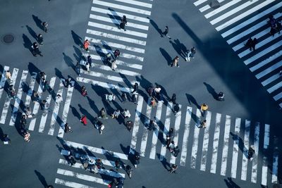 High angle view of people crossing road