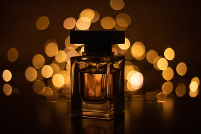 Close-up of illuminated lights on table