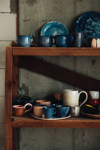 Coffee cup on shelf at home