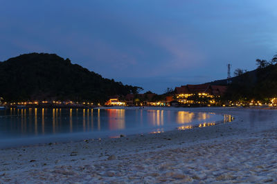 Scenic view of river against sky at night