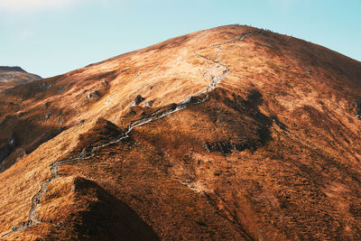 Rock formations on mountain against sky