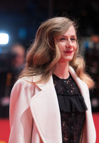 Portrait of smiling young woman standing outdoors