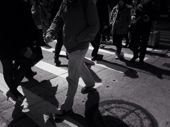 People walking on street in city