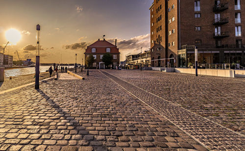 Empty street amidst buildings in city