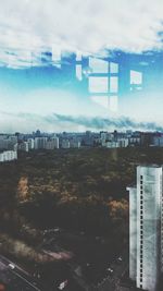 View of cityscape against cloudy sky