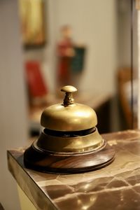 Close-up of bell on table at home