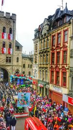 People in front of building against sky