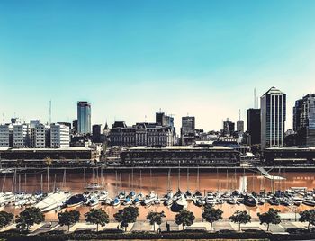 View of buildings in city against clear sky