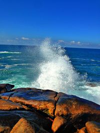 Scenic view of sea against clear blue sky