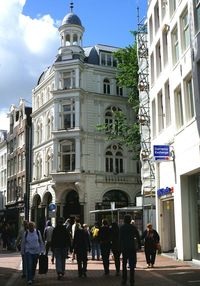 People walking in front of building