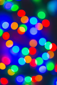 Defocused image of illuminated lights at night