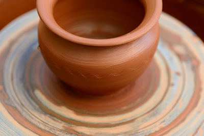 Hands of a potter. potter making ceramic pot on the pottery wheel