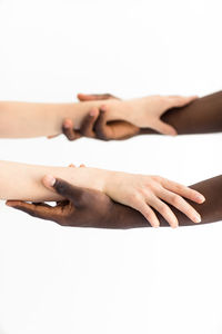 Close-up of hands over white background