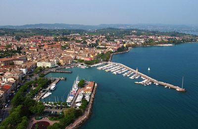 High angle view of townscape desenzano by lake gardaagainst sky