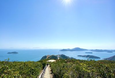 Scenic view of landscape against blue sky