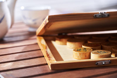 Chinsese chess pieces and chinese teapot with cup -selective focus