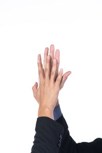 Close-up of hand against white background