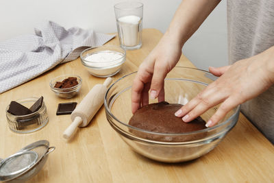 Midsection of man preparing food on table