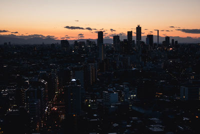 Cityscape against sky during sunset