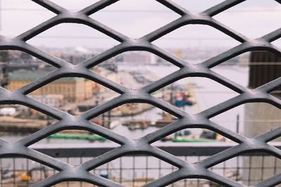Full frame shot of chainlink fence against sky
