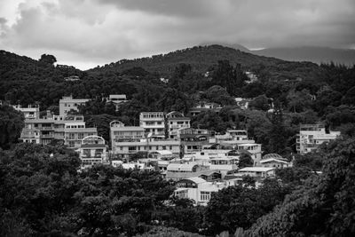 View of town against cloudy sky