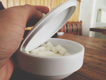 Close-up of hand holding bowl