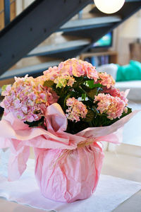 Close-up of pink roses on table