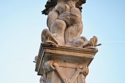 Low angle view of statue against clear sky