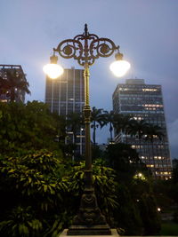 Low angle view of illuminated built structure against sky