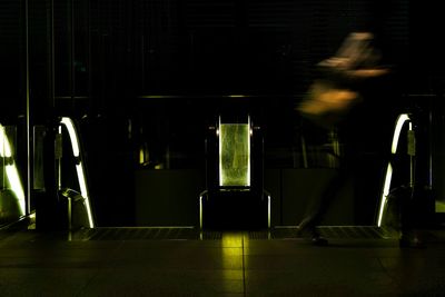 Blurred motion of person by escalator