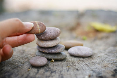 Close-up of hand holding stones