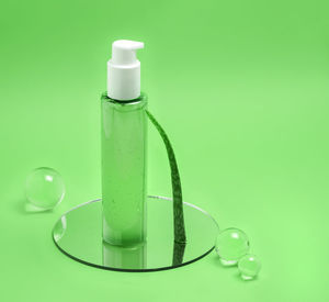 Close-up of green bottle on table