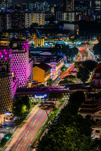 High angle view of illuminated buildings in city at night
