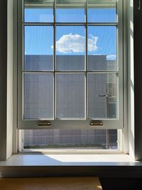 Reflection of sky on glass window