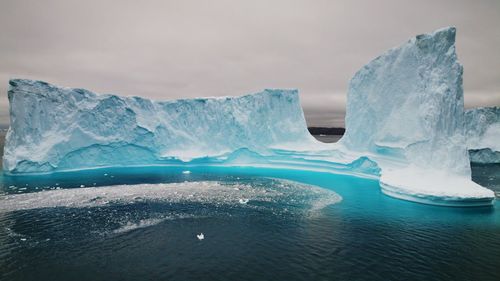 Scenic view of frozen sea against sky