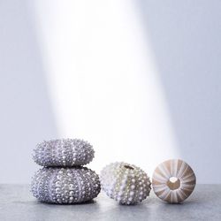 Close-up of balls on table against white background