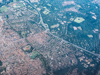 Full frame shot of field with city buildings in background